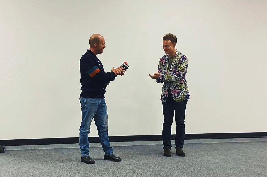 JoJo Scanlon and Gary Teitelbaum applauding each other after their Q&A at the Dam Short Film Festival