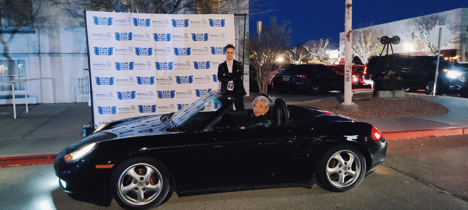 JoJo being driven to the Dam Short Film Festival award ceremony in a black 1990 Porsche 911 courtesy of the Boulder City Cruisin Association