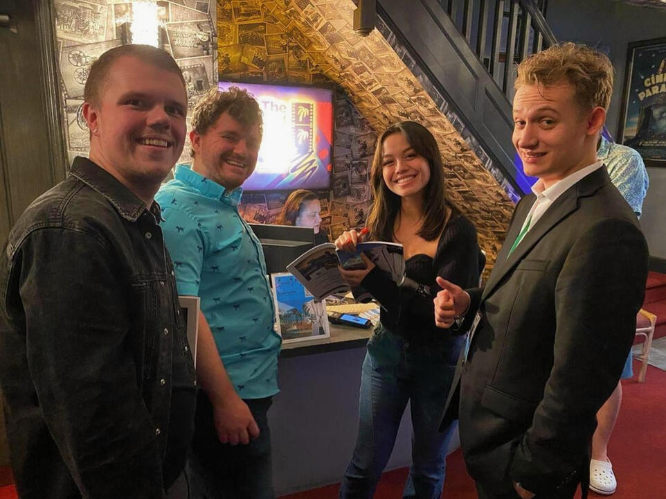 John A. Bryant, Will Brady, My Linh Tinnirella, and JoJo Scanlon signing a program after the screening at FLIFF
