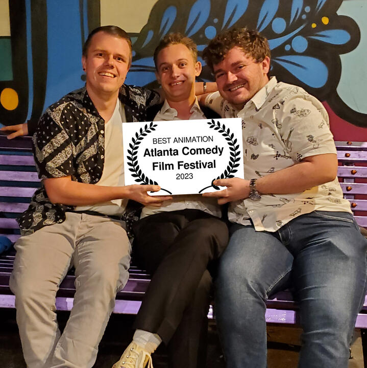 John A. Bryant, JoJo Scanlon, and Will Brady holding up their award from the Atlanta Comedy Film Festival